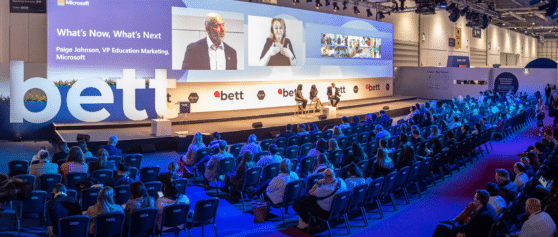 A photo of a large audience at a Bett stage at Bett UK 2022.